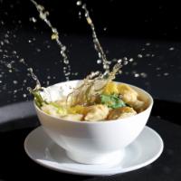 Chicken Wonton Soup · Chicken wontons, carrot, broccoli, napa cabbage, cilantro and fried garlic with clear broth.
