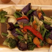 Eggplant Stir-fried · Eggplant, basil leaves and bell pepper. Served with jasmine rice. Spicy.