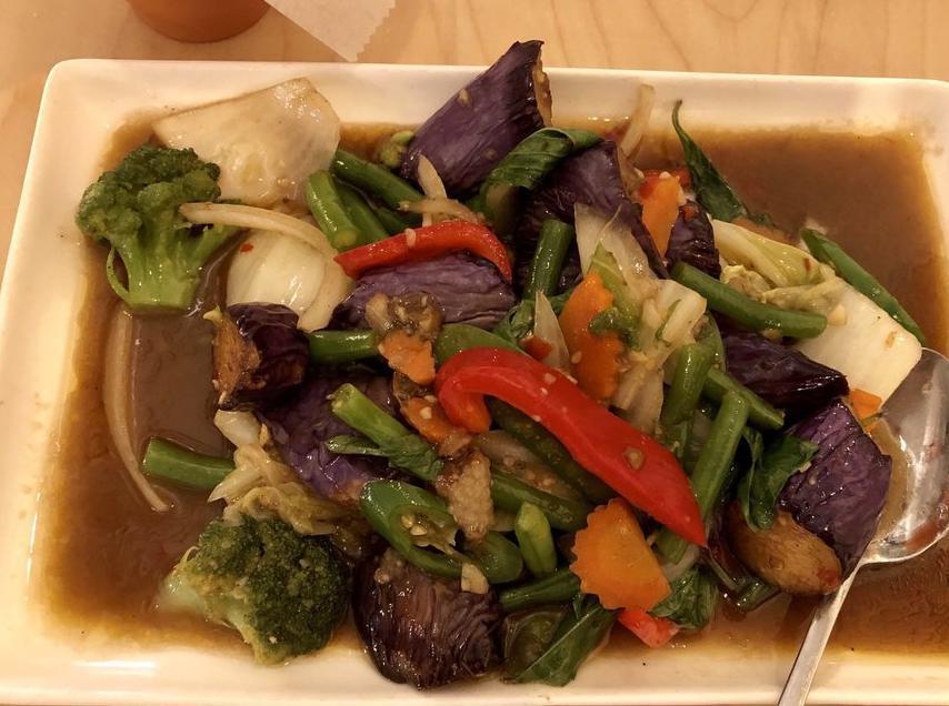 Eggplant Stir-fried · Eggplant, basil leaves and bell pepper. Served with jasmine rice. Spicy.