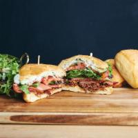 The LGBTQ · Housemade bacon jam, oven-roasted bacon, mixed greens, tomato, cucumber, basil aioli, lemon ...