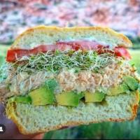 The Vegan Chickpea Toona Sammich (v) · housemade vegan chickpea toona salad, avocado, alfalfa sprouts, basil aioli, tomato, red oni...
