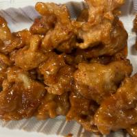 ORANGE CHICKEN  · Seasoned battered all white meat chicken deep fried than stir fried with homemade orange sau...