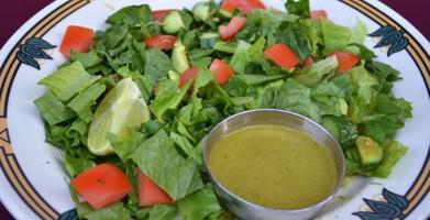 Fresh Green Salad · Fresh romaine lettuce, cucumber and tomato, with homemade cumin cilantro dressing. Vegan and...