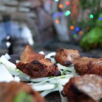 Lamb Boti Kabob · Mildly marinated boneless pieces of tender lamb. Cooked in a tandoor (clay oven) on a skewer...