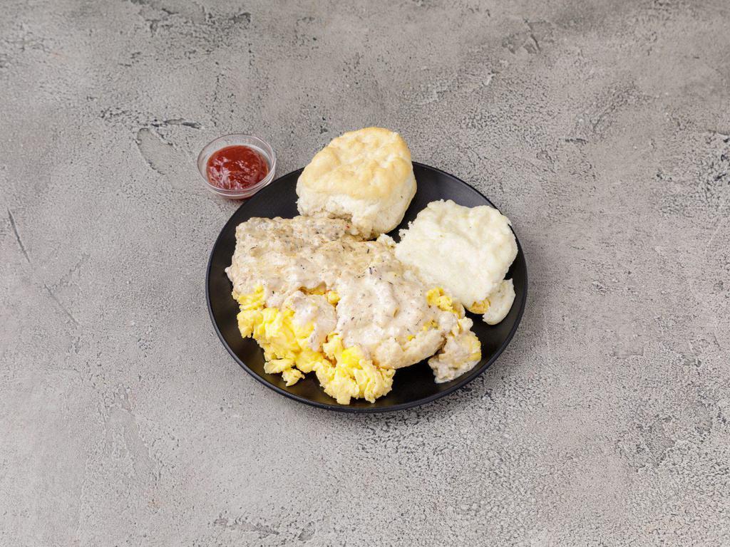 Biscuit, Eggs and Gravy · Split biscuit topped with 2 scrambled eggs, smothered with chicken sausage gravy, served with creamy dreamy grits.