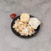 Smoked Salmon Scramble · 3 eggs scrambled with wood-smoked salmon and dill cream cheese, served with creamy dreamy gr...