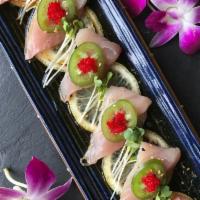 HAMACHI PONZU · Thin sliced yellowtail sashimi, Ponzu, Lemon & Jalapeno.