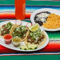 Combo 1 · 3 tacos of your choice of meat, a drink of your choice, and a side of rice & beans