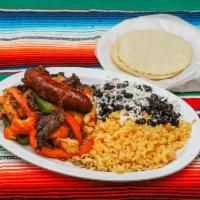 Fajitas Espanolas ·  Pollo, carne, chorizo. Spanish style chicken, beef and Mexican sausage chorizo served with ...