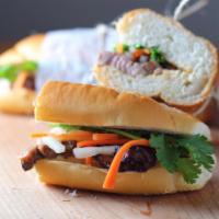 Glazed Pork Belly Sandwich · Vietnamese baguette with mayo, Sriracha, fresh and pickled veggies, bean sprouts and herbs.