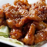 Sesame Chicken 芝麻鸡 · Boneless crispy chicken breast meat with special sauce topped with sesame seeds.