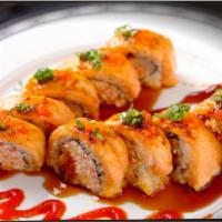 45. Spicy Baked Salmon Roll · Baked spicy crab avocado inside with salmon topped with masago, green onion and eel sauce.