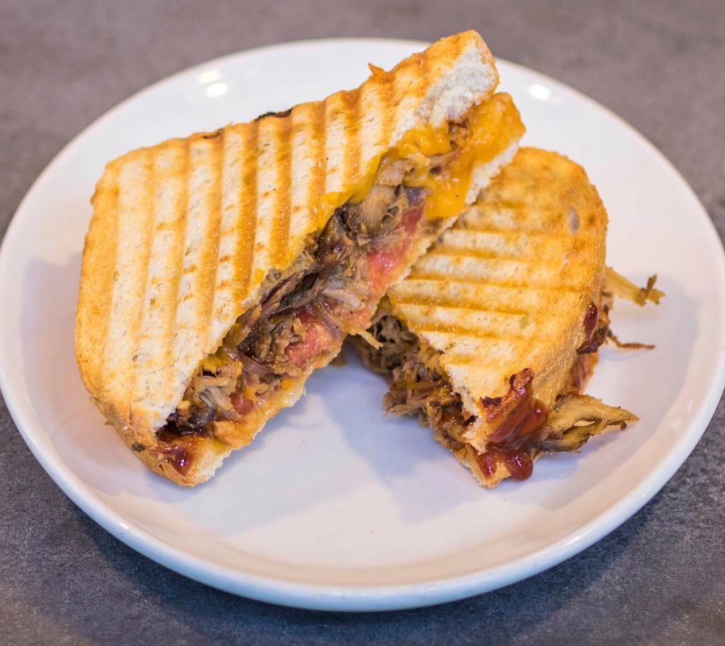 Pulled Pork Panini · BBQ pulled pork, tomato, cheddar and BBQ sauce.