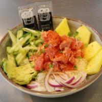 Spicy Poke Bowl · Ahi tuna, rice, pineapple, red onion, cucumber, avocado and spicy jalapeno dressing.