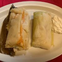 Tamales de Elote con Crema · Baby corn tamale with sour cream.