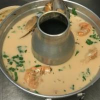 Mariscada Salvadorena · Creamed seafood mix soup, scallop, crab, squid, and shrimp Salvadorean style. Served with ri...
