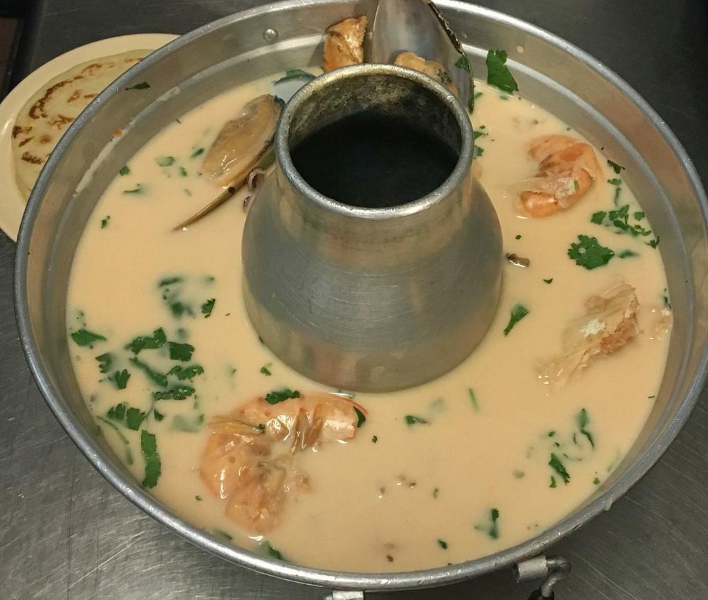 Mariscada Salvadorena · Creamed seafood mix soup, scallop, crab, squid, and shrimp Salvadorean style. Served with rice and tortillas.