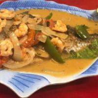 Mojarra al Vapor con Camarones · Steamed fish tilapia with shrimp. Served with rice, beans, salad, and 2 tortillas.