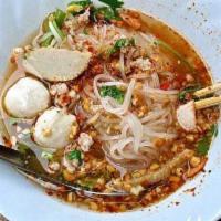 43. Tom Yum Noodle Soup · Thin rice noodles with ground chicken, shrimp, fish balls, bean sprouts, onions, cilantro, l...