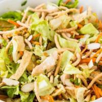 16. Asian Chopper Salad · Grilled chicken, lettuce, cabbage, carrots, onions, cilantro and crispy noodles tossed with ...