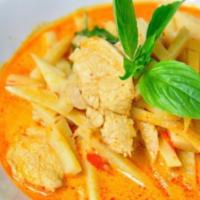 27. Red Curry · Red chili curry soup with bamboo, shoots, coconut milk, basil, peppers and your choice of me...