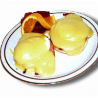 Eggs Benedict · 2 poached eggs with Canadian bacon on an English muffin topped with Hollandaise sauce.