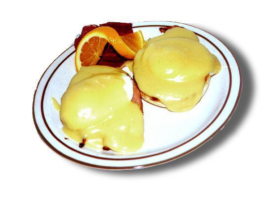 Eggs Benedict · 2 poached eggs with Canadian bacon on an English muffin topped with Hollandaise sauce.