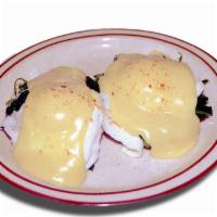 Eggs Florentine · 2 poached eggs on an English muffin with spinach and Hollandaise sauce.