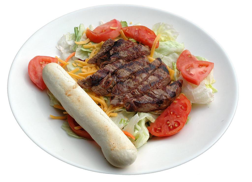 Steak Over Salad · Strips of sizzling steak on top of fresh greens, shredded cheddar Jack, tomatoes and fresh breadstick and choice of dressing.