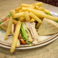 Turkey and Bacon Club · Our triple decker clubs are a complete meal and are served with French fries and a pickle, L...