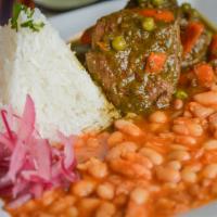 Seco de Carne con Frejoles · 8 oz. Tender cuts certified Angus beef braised in a cilantro and Peruvian sauce. Served with...