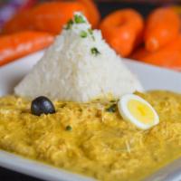 Tray - Aji de Gallina · Tray of Prime pulled chicken breast, cooked in Aji Amarillo and roasted walnuts, served over...