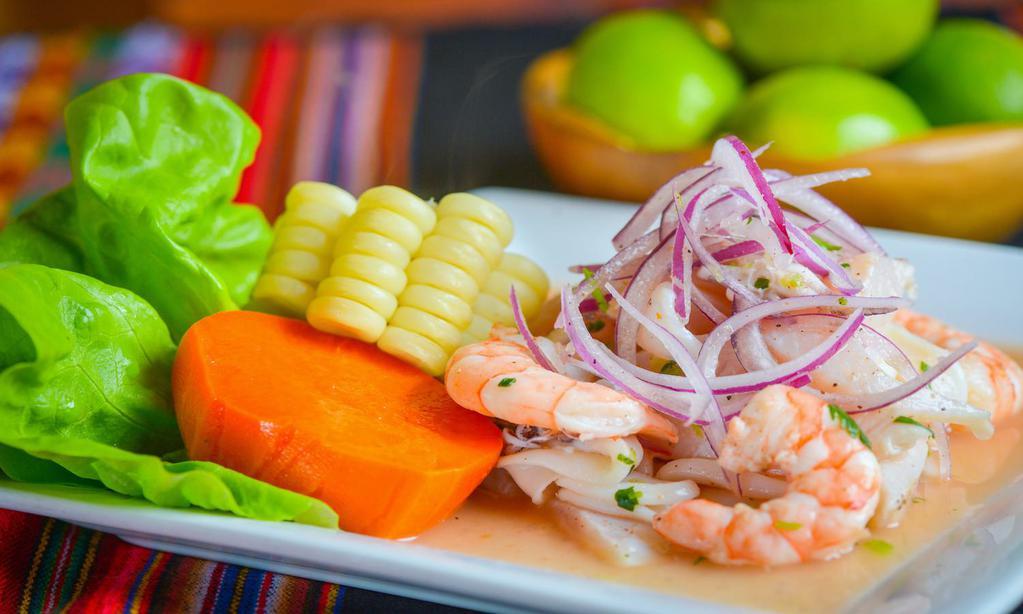 Tray - Ceviche (Mixto/Pescado) · Fresh white fish with an assortment of seafood marinated in lime juice and Peruvian rocoto pepper. Served with yam and Peruvian corn. (Request mild or spicy).