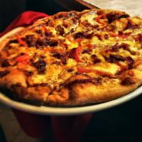 BBQ Chicken Pizza · Smokey BBQ Sauce, fire roasted chicken, bacon, pickled red onions, cheddar cheese and Napa c...