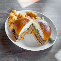 Jucy Lucy Burger · Minnesota original 8oz. patty cheddar and American stuffed burger, pickle and grilled onion,...