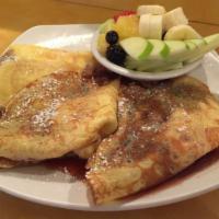 Cottage Cheese and Sauteed Strawberry Crepes · Served with a side of fruit.