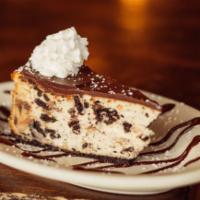 Oreo Cheesecake · Chocolate crust, Oreo cookie cheesecake, chocolate ganache.