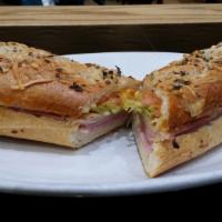 Monte Cristo Sub · Grilled ham, turkey, melted Swiss, cheddar cheese, lettuce, tomatoes and honey mustard.