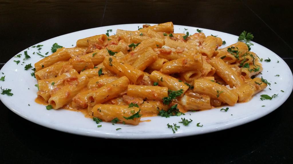 Rigatoni Vodka Dinner · Served with prosciutto crudo and choice of side, bread and butter.
