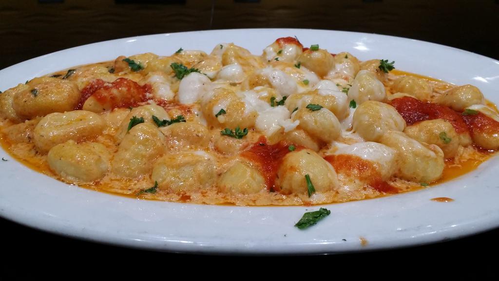 Gnocchi Sorrento Dinner · Mozzarella, basil, Parmigiana cheese and cream sauce. Served with choice of side, bread and butter.