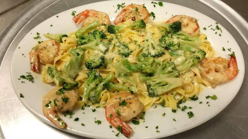 Shrimp Broccoli and Alfredo Dinner · Over fettuccine. Served with choice of side, bread and butter.