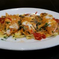 Fantasia · Over fettuccine, sherry wine, pink cream sauce, spinach and mozzarella. Served with soup or ...