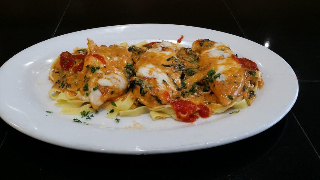 Fantasia · Over fettuccine, sherry wine, pink cream sauce, spinach and mozzarella. Served with soup or salad, bread and butter.