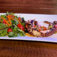 Grilled Octopus · Grilled octopus with Jerez vinaigrette sweet peppers, onions, fresh lime juice and olive oil.