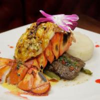 Surf and Turf · Churrasco & Lobster tail in chimichurri sauce & lobster sauce with Veggies and mash potatoes