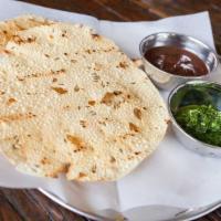 Pappadum and Chutney · Grilled lentil chips with chutney.