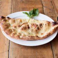 Utilitara Calzone · Pepperoni, sausage, mushrooms, herbed ricotta, mozzarella and tomato sauce.