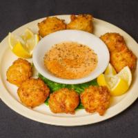 Linda's Conch Fritters · With a tangy ranch sauce.