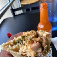 Burrito Supreme · Flour Tortilla, Meat, Cheese, Sour Cream, Onions, Cilantro, Salsa, & Beans