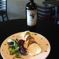 Caprese Plate · Fresh sliced tomatoes, mozzarella and basil drizzled with extra virgin olive oil.